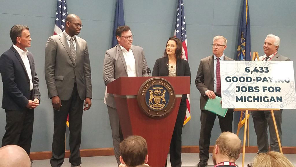Mark Stewart, Chief Operating Officer, FCA-North America, shares the podium with Michigan Gov. Gretchen Whitmer and other leaders in Lansing as the company and state finalize arrangements for major investment in Detroit and southeast Michigan.